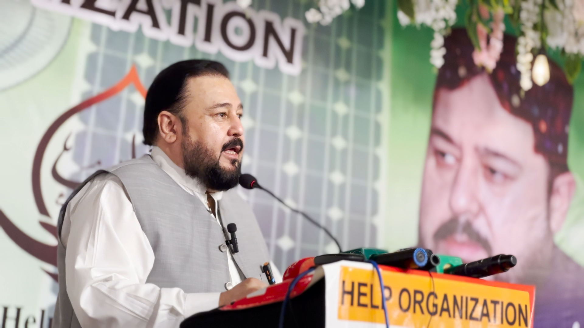 HELP Organization chairman speaking at an event